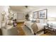 Inviting bedroom with modern decor, wood floors and comfortable seating at 2480 W Caithness Pl # 5, Denver, CO 80211