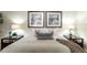 Close-up of a beautifully styled bed with decorative pillows and side tables at 2480 W Caithness Pl # 5, Denver, CO 80211
