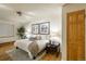 Bright bedroom featuring a cozy rug, nightstands and stylish decor at 2480 W Caithness Pl # 5, Denver, CO 80211