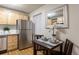 Cozy eat-in kitchen with stainless steel appliances and plenty of counter space at 2480 W Caithness Pl # 5, Denver, CO 80211