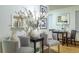 Inviting living area with comfortable chairs, decorative accents and kitchen view at 2480 W Caithness Pl # 5, Denver, CO 80211