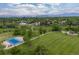 Expansive green space features a playground, walking paths, and a basketball court, set against a backdrop of lush greenery at 7715 Estes Ct, Arvada, CO 80005