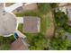 Aerial view of the house and lawn featuring a private driveway and a fenced backyard at 7715 Estes Ct, Arvada, CO 80005