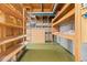 Basement with exposed ceiling with storage shelves and unfinished walls at 7715 Estes Ct, Arvada, CO 80005