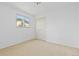Bedroom with neutral carpet, double closet, and window that brings in natural light at 7715 Estes Ct, Arvada, CO 80005