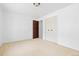 Bright bedroom with a closet, neutral carpet, and a door to other rooms at 7715 Estes Ct, Arvada, CO 80005