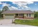 Charming home with an attached two-car garage and well-maintained lawn at 7715 Estes Ct, Arvada, CO 80005