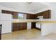 Functional kitchen with ample cabinet space, updated appliances, and bright, retro-style flooring at 7715 Estes Ct, Arvada, CO 80005