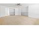 Spacious living room with soft carpet, ceiling fan, and a minimalist design at 7715 Estes Ct, Arvada, CO 80005