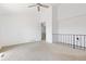 Bright living room with neutral carpet, ceiling fan, and an open layout at 7715 Estes Ct, Arvada, CO 80005
