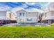 Exterior view of backyard with fenced yard and sunny sky at 15333 E 98Th Pl, Commerce City, CO 80022