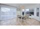 Bright dining area with natural light, tile floors, and access to the backyard at 15333 E 98Th Pl, Commerce City, CO 80022