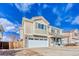 Inviting two-story home featuring stone accents, a two-car garage, and a charming front porch at 15333 E 98Th Pl, Commerce City, CO 80022