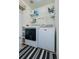 Practical laundry room with washer, dryer, and storage shelves at 15333 E 98Th Pl, Commerce City, CO 80022