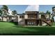 Back of modern home featuring a two-story deck with stairs and large windows at 1721 Arrowpoint Ct, Franktown, CO 80116