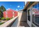 Balcony of a unit with view of exterior and adjacent red brick building at 2690 E Otero Pl # 7, Centennial, CO 80122