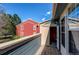 Balcony with open sliding glass door facing neighboring brick building at 2690 E Otero Pl # 7, Centennial, CO 80122