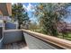 Balcony with views of mature trees and blue sky at 2690 E Otero Pl # 7, Centennial, CO 80122