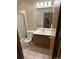 Clean bathroom featuring a shower, a toilet, a vanity with a sink, and tile flooring at 2690 E Otero Pl # 7, Centennial, CO 80122