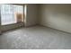Cozy bedroom featuring neutral carpet, a large window with blinds, and ample natural light at 2690 E Otero Pl # 7, Centennial, CO 80122