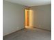 Simple bedroom featuring neutral walls, carpet, and a closet door at 2690 E Otero Pl # 7, Centennial, CO 80122
