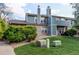 Exterior view of building on well-manicured lawn with walkway at 2690 E Otero Pl # 7, Centennial, CO 80122