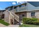 Inviting two-story townhome with brick and wood facade, complemented by well-maintained landscaping at 2690 E Otero Pl # 7, Centennial, CO 80122