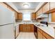 Well-maintained kitchen featuring ample counter space and wooden cabinets at 2690 E Otero Pl # 7, Centennial, CO 80122