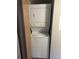Functional laundry area featuring a stacked washer and dryer unit at 2690 E Otero Pl # 7, Centennial, CO 80122