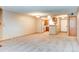 Open-concept living area with updated flooring and connection to the kitchen at 2690 E Otero Pl # 7, Centennial, CO 80122