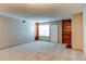 Bright living room with neutral carpet, fireplace, and built-in shelving at 2690 E Otero Pl # 7, Centennial, CO 80122