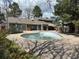 Community pool awaiting restoration with tanning deck and clubhouse building at 2690 E Otero Pl # 7, Centennial, CO 80122