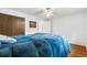 Cozy bedroom features a plush blue comforter and a closet with paneled doors at 2730 S Jay St, Denver, CO 80227