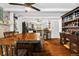 Dining Room with hardwood floors, dark wood dining set, and a view into the kitchen at 2730 S Jay St, Denver, CO 80227