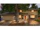 Charming two-story home featuring brick accents, mature trees, and a welcoming entrance at 2730 S Jay St, Denver, CO 80227