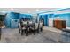 Finished basement game room with a large table, sofa, game shelves, and blue lighting at 2730 S Jay St, Denver, CO 80227