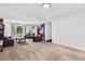 Spacious living room with a large window, featuring neutral carpeting and ample seating at 2730 S Jay St, Denver, CO 80227