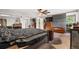 Spacious main bedroom featuring a ceiling fan, closet, and rustic sliding barn door at 2730 S Jay St, Denver, CO 80227