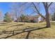 Backyard with mature trees and green grass, the exterior of the house is visible at 5946 S Jellison St # F, Littleton, CO 80123