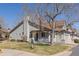 Charming home with neutral siding, tile roof, and well-manicured front yard at 5946 S Jellison St # F, Littleton, CO 80123