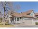 Charming home featuring a well-maintained front yard and attached two-car garage at 5946 S Jellison St # F, Littleton, CO 80123