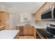 Modern kitchen featuring stainless steel appliances, ample counter space, and a functional island at 5946 S Jellison St # F, Littleton, CO 80123