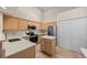 Modern kitchen featuring stainless steel appliances, ample counter space, and a functional island at 5946 S Jellison St # F, Littleton, CO 80123