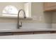 Close-up of the kitchen sink and countertop, showcasing modern fixtures and finishes at 5946 S Jellison St # F, Littleton, CO 80123