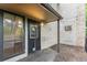 Spacious outdoor back porch with lighting and plenty of room for entertaining at 3550 S Harlan St # 105, Denver, CO 80235