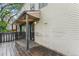 Spacious outdoor back porch with lighting and plenty of room for entertaining at 3550 S Harlan St # 105, Denver, CO 80235