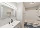 Stylish bathroom with modern sink, toilet, mirror, shower, and bath with attractive nautical theming at 3550 S Harlan St # 105, Denver, CO 80235
