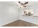 Dining area featuring laminate floor, with an archway view of the kitchen with granite counter at 3550 S Harlan St # 105, Denver, CO 80235