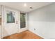 Bright and airy dining area with vinyl flooring and door leading to outdoor space at 3550 S Harlan St # 105, Denver, CO 80235