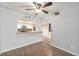View of kitchen from the dining room featuring breakfast bar and open archway at 3550 S Harlan St # 105, Denver, CO 80235